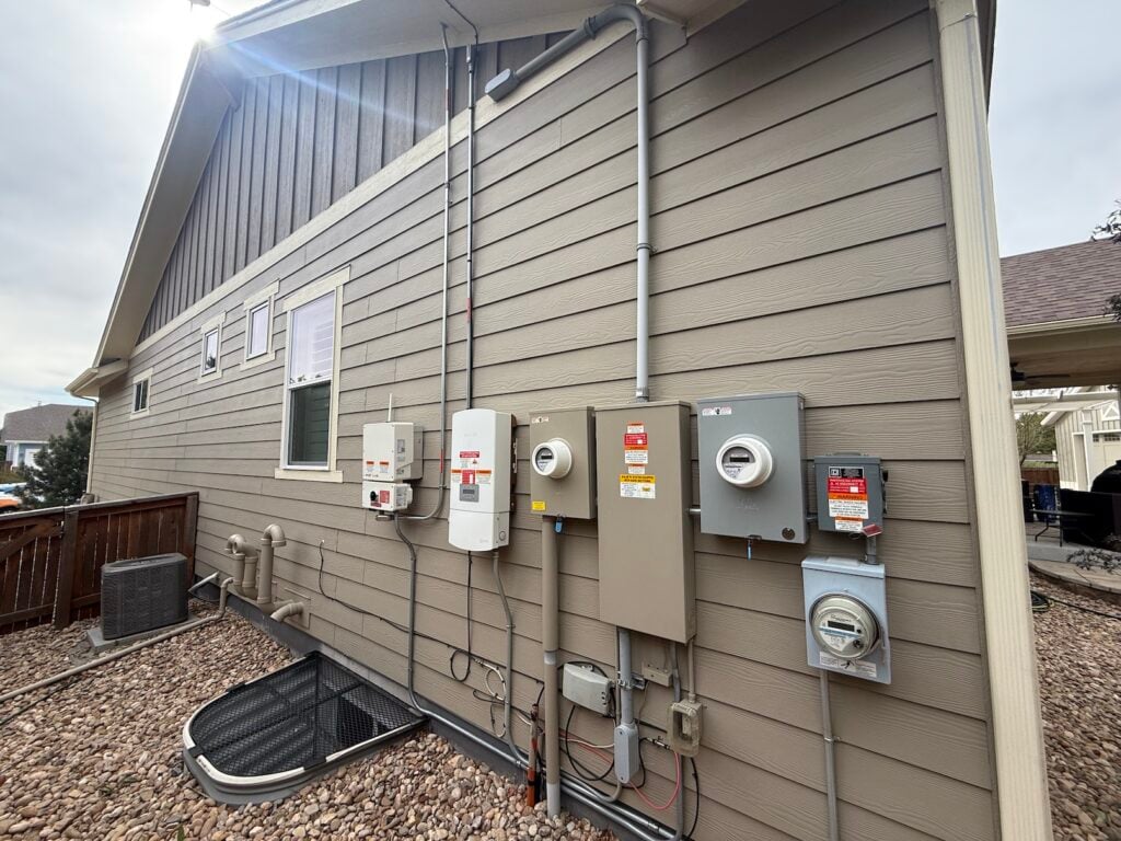 An impressive electrical meter stack with subpanels and solar hooked up.