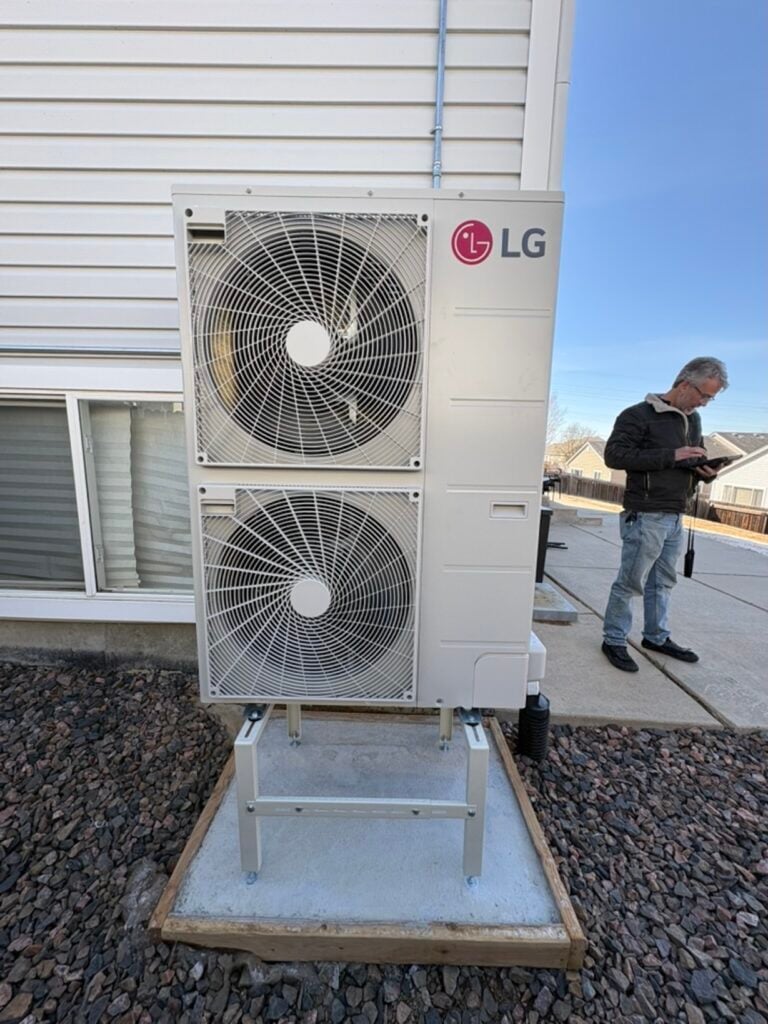 the hear inspector inspecting our work on the new outdoor lg red heat pump