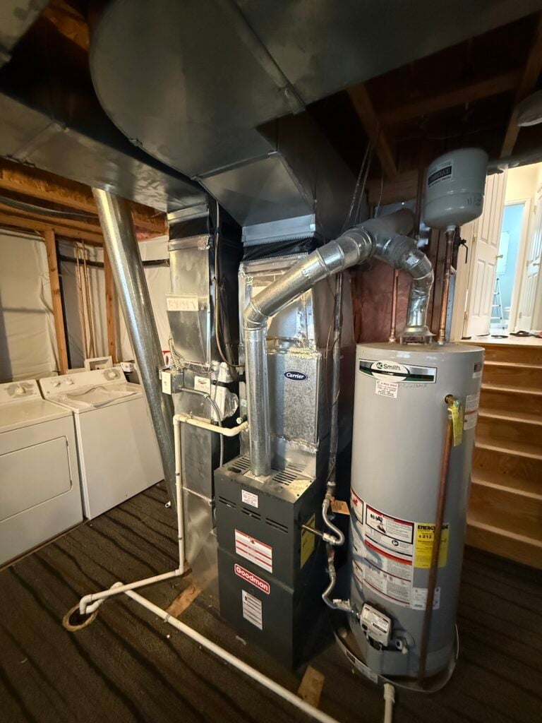the furnace air handler and blower in chris's basement
