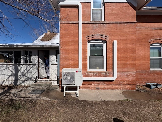 heat pump exterior of the house with brick