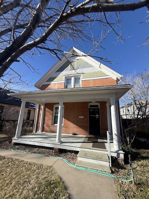 old brick home outside of house front porch