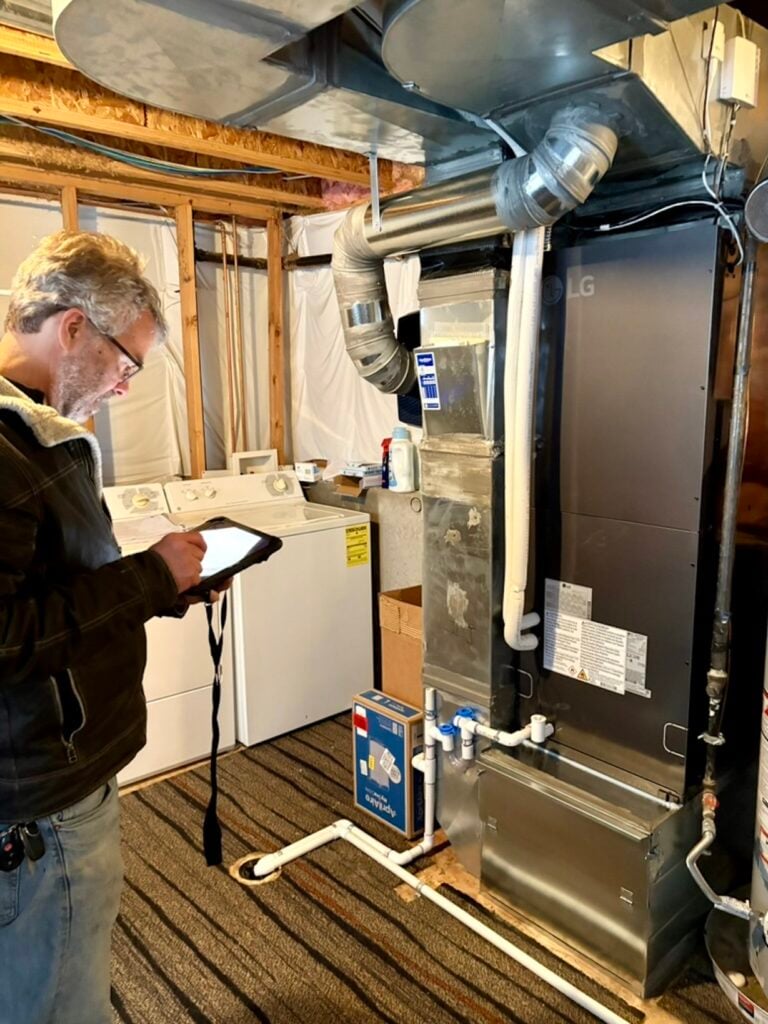 the hear rebate colorado energy office inspector checking out the new lg air handler
