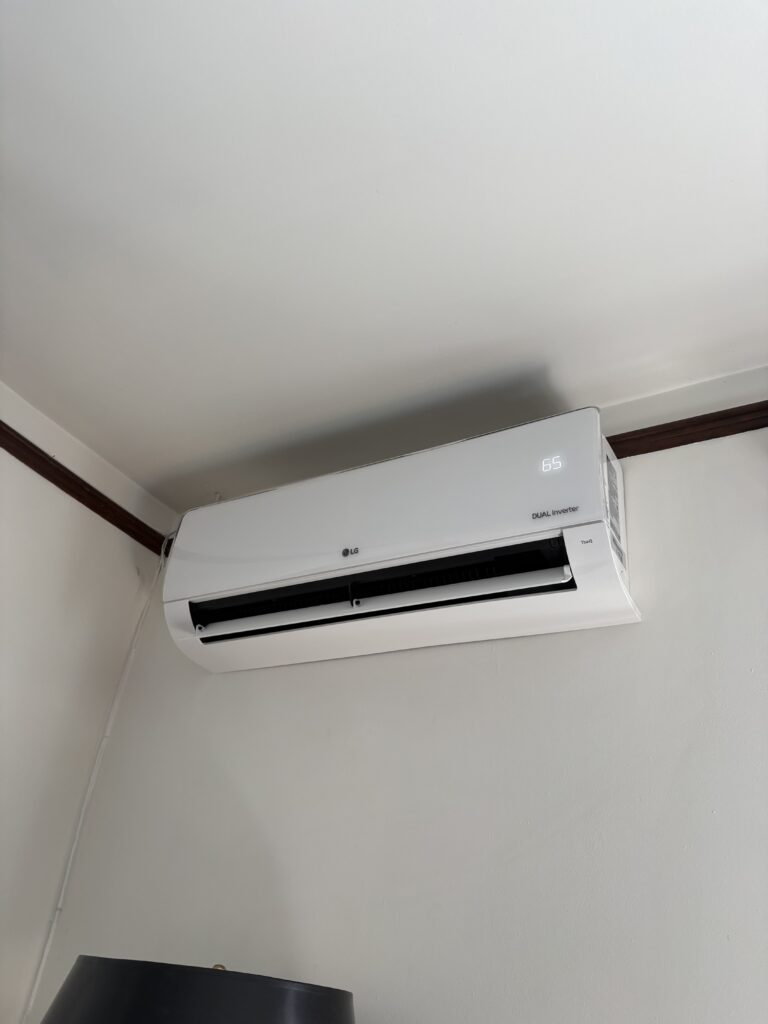 An LG mini split wall mount white unit installed in our customer's basement hallway in Lakewood CO