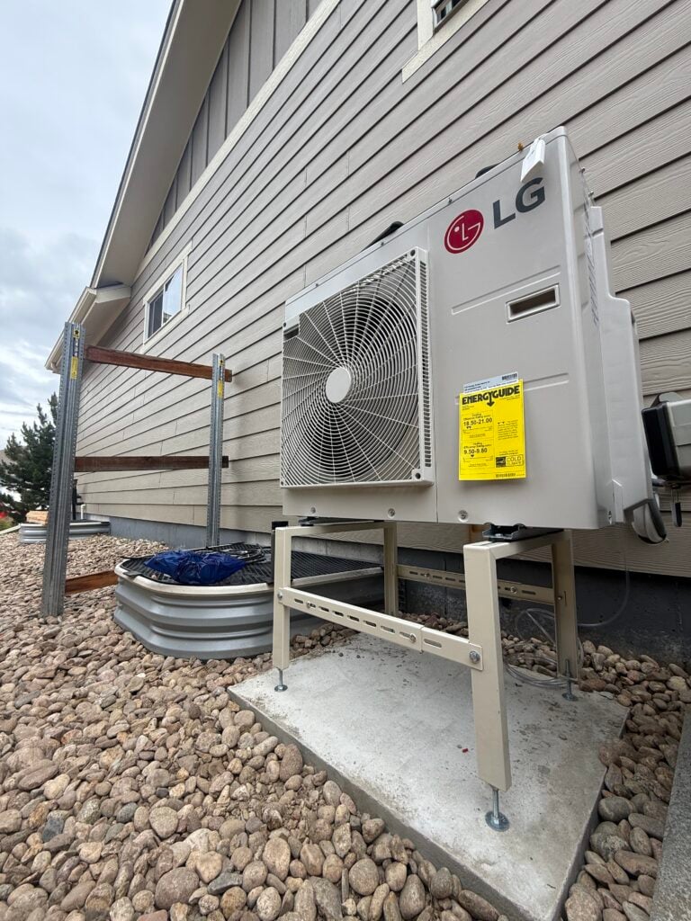 A 2 ton LG RED Multizone condenser installed on our concrete pad on the side of our Lakewood CO customer's home