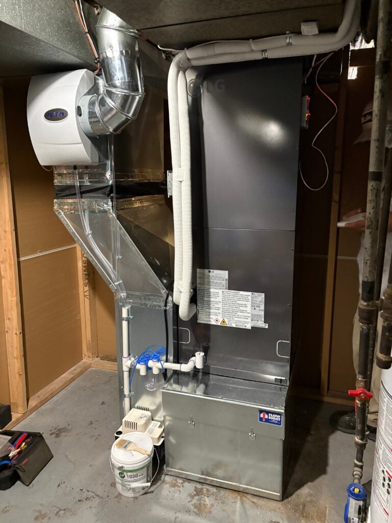 Our Washington Park Denver customer's new LG RED air handler installed in their basement with a humidifier attached and lots of new ductwork modifications.