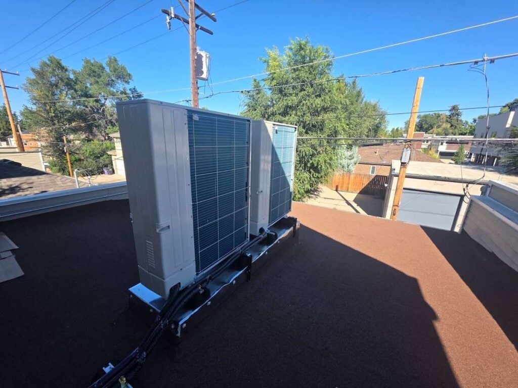 The back side of our Mitsubishi heat pump condensers on the roof of our Cherry Creek Denver, CO customer's two-story home.